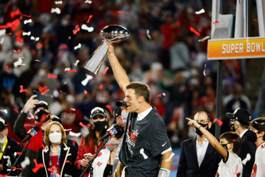 Tom Brady hoisting the Lombardi Trophy for the seventh time after defeating the Kansas City Chiefs