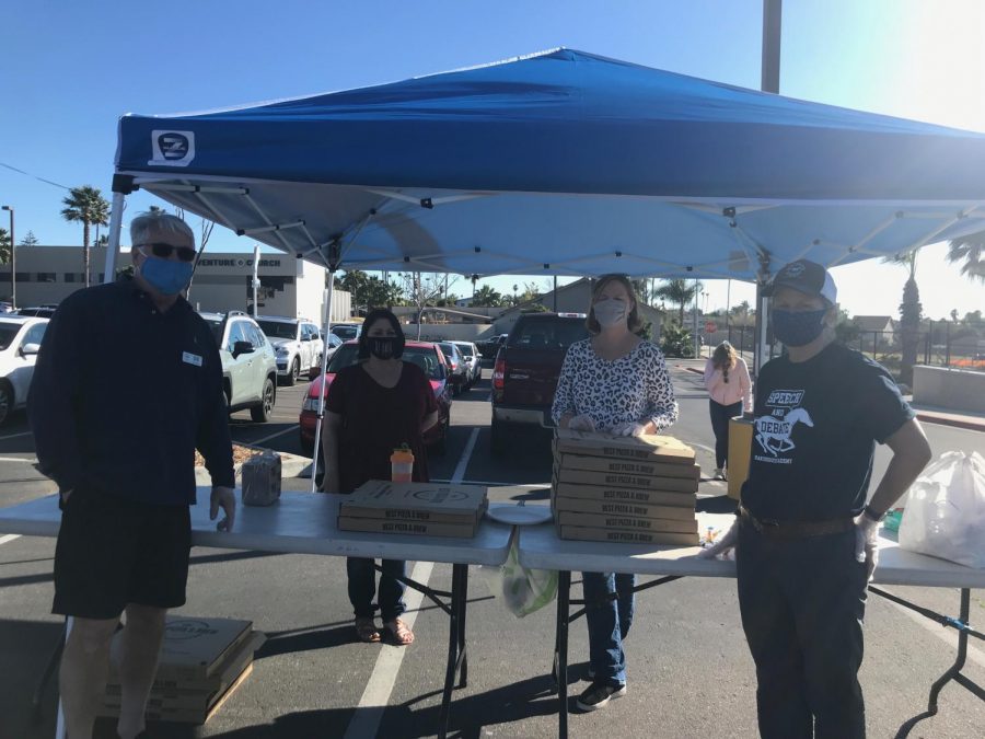 From left to right: Kevin Baum, Lisa Tucker, Stephanie Baum, and Kathy Urbanic volunteering at the booth in the front parking lot on Feb. 18, 2021