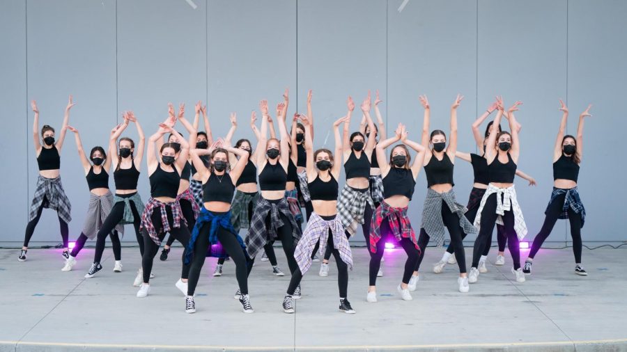 Group of dancers raising their hands