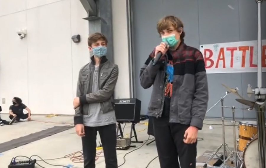 two boys giving a speech