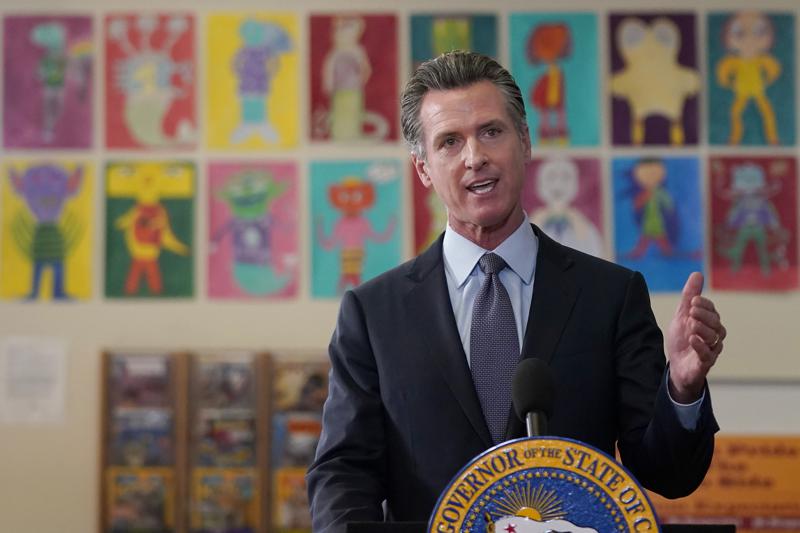 Governor Gavin Newsom announces his mandate at James Denman Middle School in San Francisco. Courtesy of AP Photo/Jeff Chiu