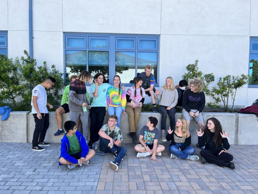 Students and faculty dressed in colorful attire for Tie-Dye Day