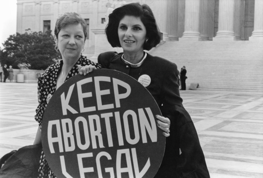 Norma+McCorvey%2C+left%2C+who+was+Jane+Roe+in+the+1973+Roe+v.+Wade+case%2C+with+her+attorney%2C+Gloria+Allred%2C+outside+the+Supreme+Court+in+April+1989%2C+where+the+Court+heard+arguments+in+a+case+that+could+have+overturned+the+Roe+v.+Wade+decision.+Courtesy+of+Lorie+Shaull.