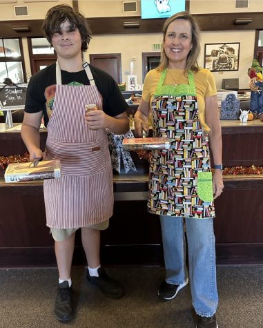 Freshman James Durkin and Sue Foote pose in their grill parent outfits.