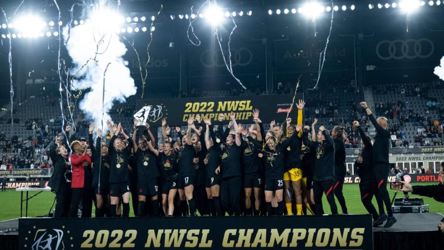 The Portland Thorns lift the NWSL Championship trophy last season