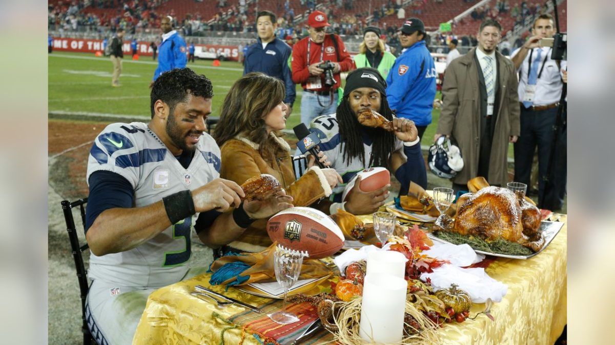The Seahawks Richard Sherman and Russel Wilson celebrating a Thanksgiving dinner after a win versus the 49ers in 2014.