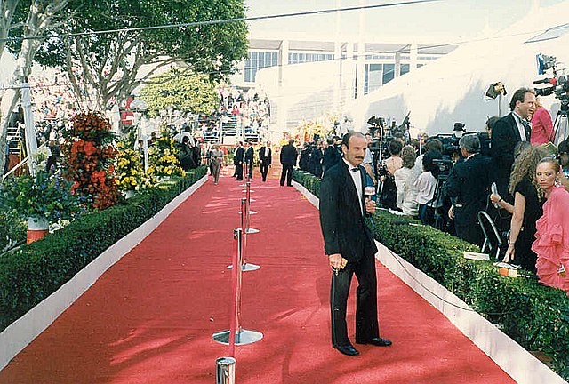 An Oscars interviewer is getting ready to speak with the stars and starlets.